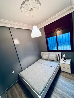 a small bedroom with a bed and a window at Appartement très équipé etpropre 1 in Camp de Mediouna