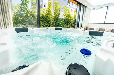 a jacuzzi tub with a blue frisbee in it at Appartement Duplex G1 in Casablanca