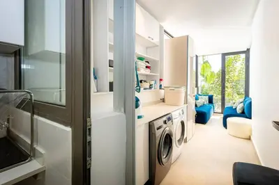a laundry room with a washer and dryer at Appartement Duplex G1 in Casablanca