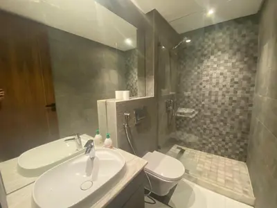 a bathroom with a sink and a toilet at Hilbert Princesses - Furnished apartments in Casablanca
