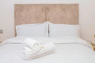 a white bed with towels on top of it at Magnificient Appartment in Prestigia in Rabat
