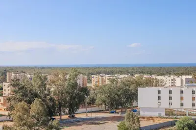 an aerial view of a city with trees and buildings at Magnificient Appartment in Prestigia in Rabat