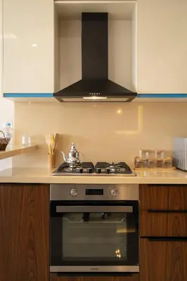 a kitchen with a stove top oven in a kitchen at Maarif princess amazing one bedroom flat in Casablanca