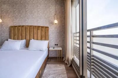 a bedroom with a large bed and a window at Maarif princess amazing one bedroom flat in Casablanca