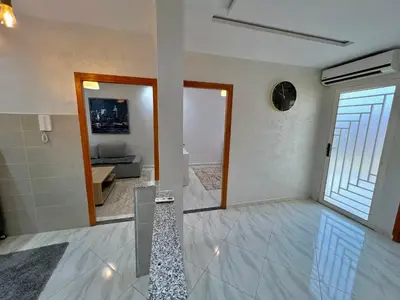 a living room with a view of a living room at A3 Luxe and Cosy Apartement, 7 min du Stade Moulay Abdellah in Temara