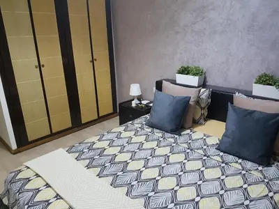 a bedroom with a bed and two pillows at High-End Apartment with Terrace in Val Fleuri, Maarif Casablanca, Ideal for Families & Business Travelers in Casablanca