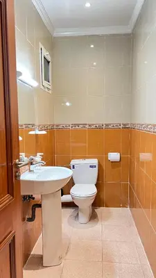 a bathroom with a toilet and a sink at SUITOUISS - Agdal 1 - Appartement à 2 minutes de la gare de train TGV Rabat in Rabat