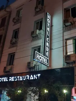 a hotel sign on the side of a building at Cadé Hotel in Casablanca