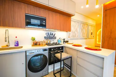 a kitchen with a washing machine in a kitchen at ROYAL ANFA PARK SUITE-BY AYLA STAY in Casablanca