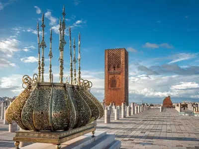 a large vase sitting in front of a clock tower at Agdal 1 in Rabat
