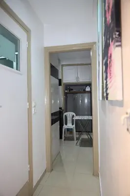 a hallway with a door leading to a kitchen at Agdal 1 in Rabat