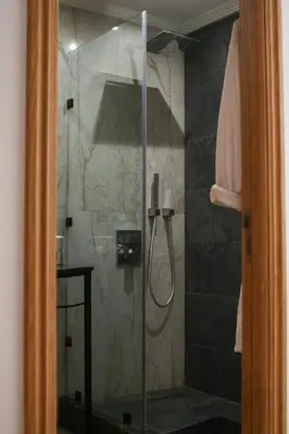 a shower with a glass door in a bathroom at Maarif , Cosy 2 Chambres, Parking wifi Netflix Gratuit in Casablanca