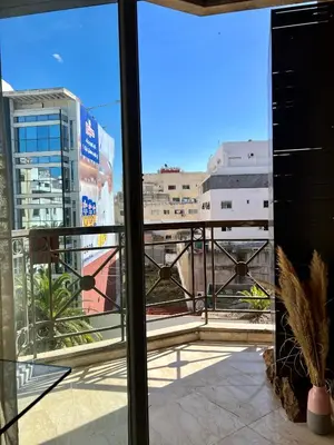a view of a city from a balcony at Maarif , Cosy 2 Chambres, Parking wifi Netflix Gratuit in Casablanca