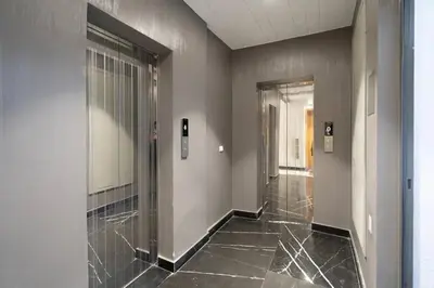 a hallway with a glass door in a building at Charming apartment at Maarif in Casablanca