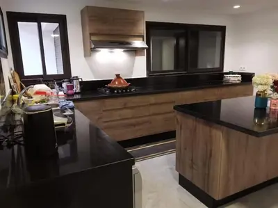 a kitchen with a black counter top in a room at Luxury Villa Jack Beach Resort Ocean Oasis View Panoramic in Casablanca