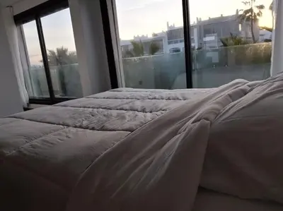 two beds in a bedroom with a large window at Luxury Villa Jack Beach Resort Ocean Oasis View Panoramic in Casablanca