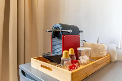 a coffee maker on a table in a room at AeroHarmony in Nouaceur