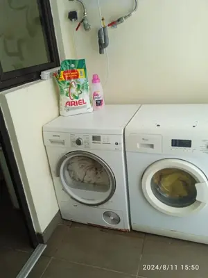 a laundry room with a washing machine and a washer at Ocean View Apartment - Anfa Place - in Casablanca