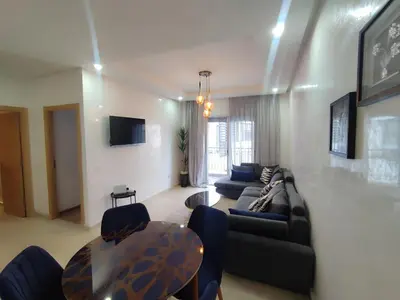 a living room with a couch and a table at Studio La gironde in Casablanca