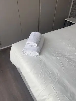 a white towel sitting on top of a bed at Magic Appartement Luxury Gauthier 10 in Casablanca