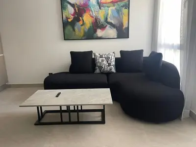 a living room with a couch and a coffee table at Magic Appartement Luxury Gauthier 10 in Casablanca