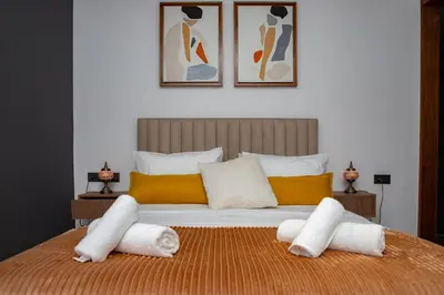 a bedroom with a large bed with towels on it at Appartement neuf 2 chambres avec salle de sport in Casablanca