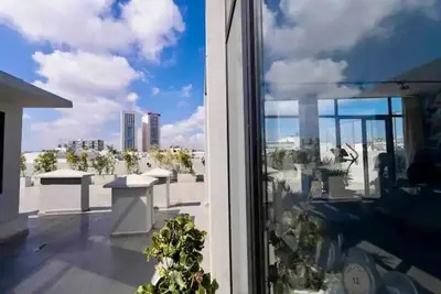 a view of a balcony with a view of a city at Appartement neuf 2 chambres avec salle de sport in Casablanca