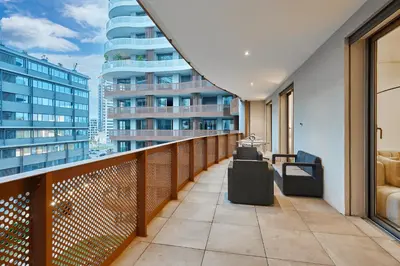 a balcony with a view of a tall building at Modern Unit in Casa Finance City With Free Parking in Casablanca