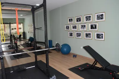 a room with a gym with weights and exercise equipment at Luxury apartment fully furnished in Casablanca