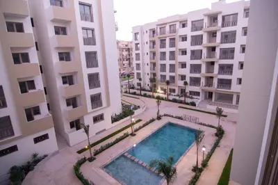 an overhead view of a swimming pool between two buildings at Luxury apartment fully furnished in Casablanca