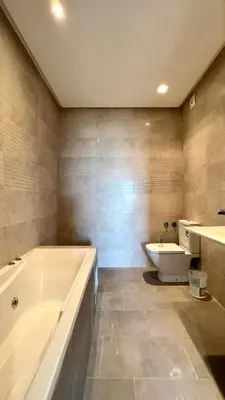 a bathroom with a tub and a sink and a toilet at The building of Terrazas 34 - By AppartAli in Casablanca