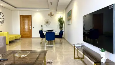 a living room with a large flat screen tv at The building of Terrazas 34 - By AppartAli in Casablanca