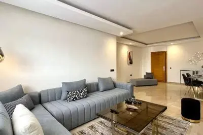 a living room with a couch and a table at Business Travelers and Families - 3 Bedrooms in Casablanca