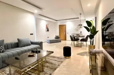 a living room with a couch and a table at Business Travelers and Families - 3 Bedrooms in Casablanca