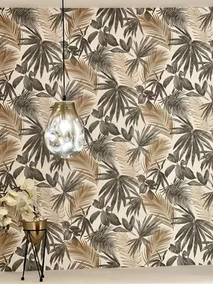 a lamp hanging from a wall with a flowery wallpaper at La Vida est Magnifique - 3 Chambres in Casablanca