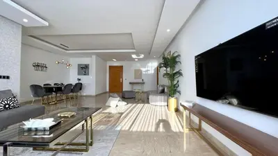 a living room with a large flat screen tv at Marvelous Center Spot - 3 Bedrooms in Casablanca