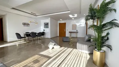 a living room with a couch and a table with chairs at Marvelous Center Spot - 3 Bedrooms in Casablanca