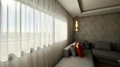 a living room with a couch and a window at Family 3 Bedrooms- By AppartAli in Casablanca