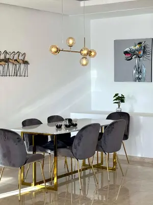 a dining room with a table and chairs at Family 3 Bedrooms- By AppartAli in Casablanca
