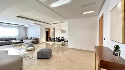 a living room with a couch and a table at Family 3 Bedrooms- By AppartAli in Casablanca