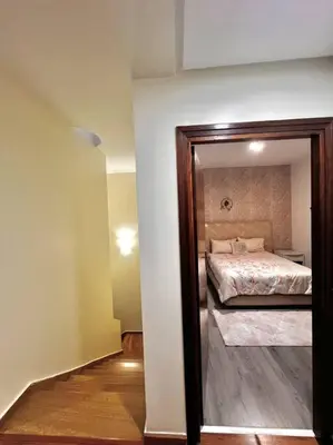 a bedroom with a bed and a large mirror at Nassali - Luxurious Beachfront Villa with Private Pool in Casablanca