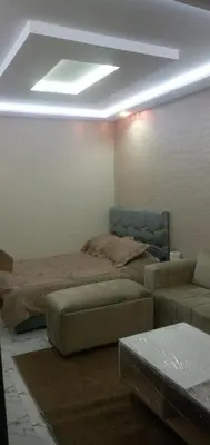 a living room with a bed and a couch at Studio Zenith in Casablanca