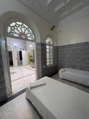 a bedroom with two beds in a room at Riad Blue Garden in Rabat