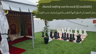 a chess set on a lawn in front of a tent at Rooms in shared apartment close to CMN-Airport in Dah Hammou Ben Cheïkh