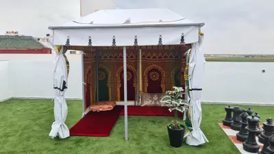 a gazebo with a bed in the grass at Rooms in shared apartment close to CMN-Airport in Dah Hammou Ben Cheïkh