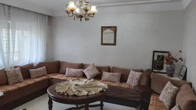 a living room with a couch and a table at tranquil harmony in Casablanca