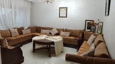 a living room with a couch and a table at tranquil harmony in Casablanca