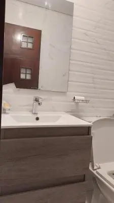 a bathroom with a sink and a mirror and a toilet at tranquil harmony in Casablanca