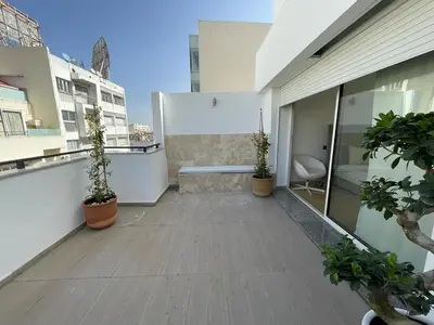 a balcony with potted plants on a building at Central, terrasse, confortable - Bleue résidence in Casablanca
