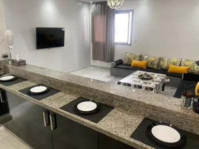 a kitchen with a counter top with two sinks at Marbella beach appart de standing in Mansouria